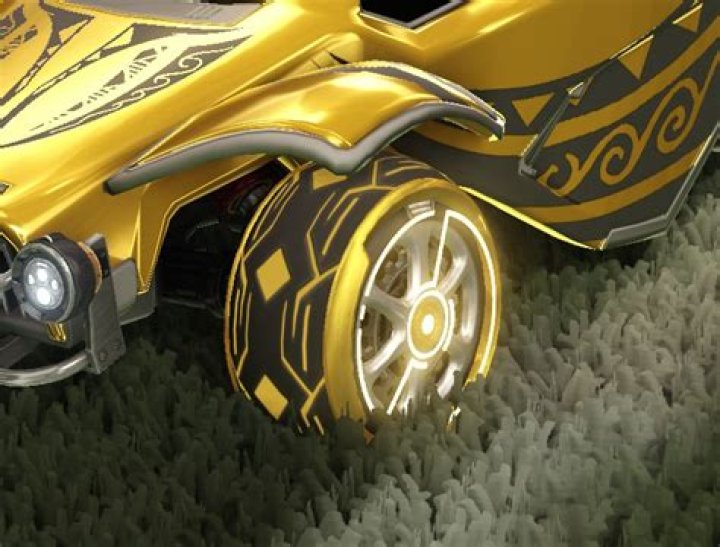 Can you help me identify these glowing gold and black patterned wheels in Rocket League?