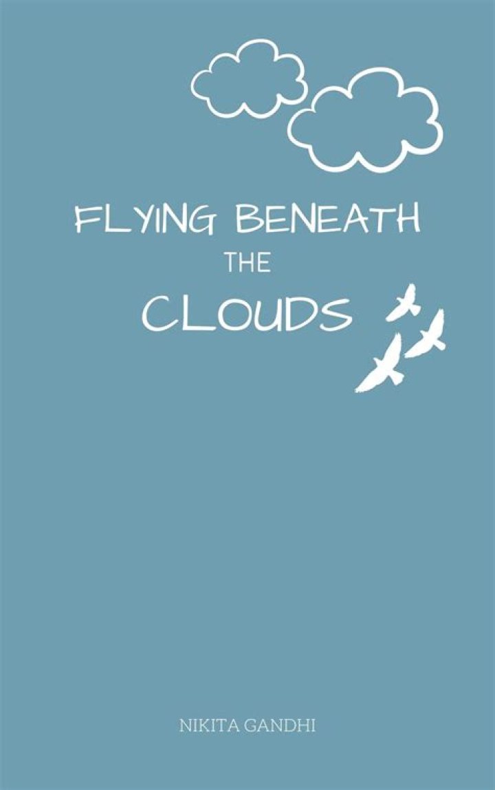 Flying beneath the clouds.