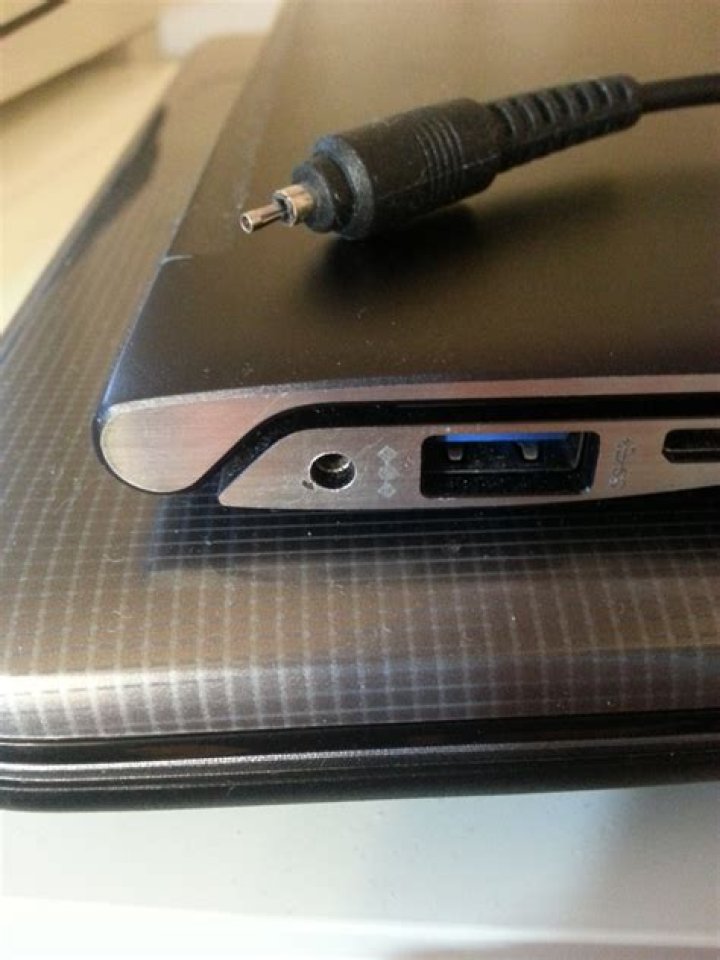 Part of the power connector broken and stuck inside laptop power jack - how to fix?