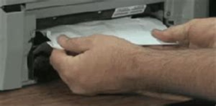 Removing torn bits of paper from printer