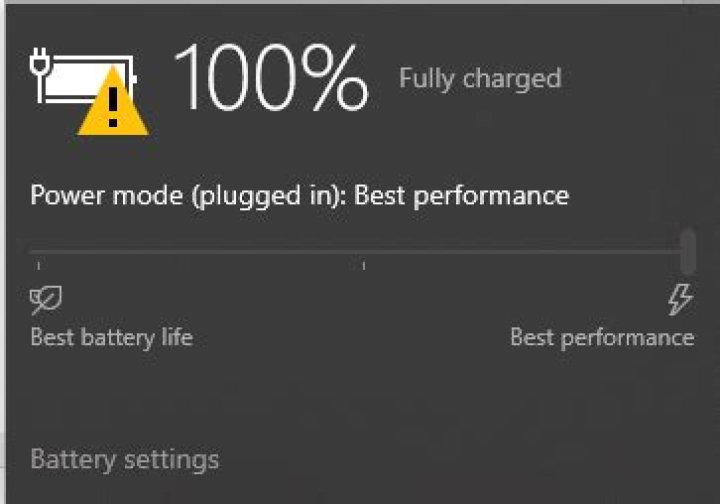 What does the warning sign over battery icon represent?